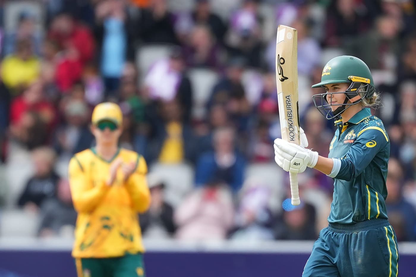 Australia celebrates victory in Women's T20 World Cup opener against South Africa.