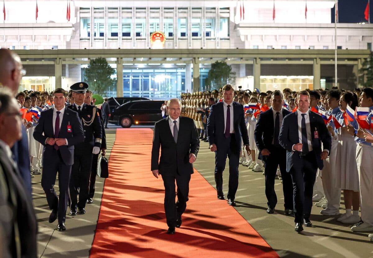Putin and Xi Jinping discussing energy cooperation in Beijing.