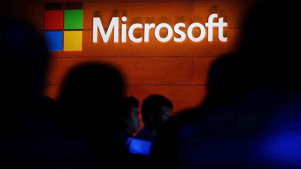 Minimalist slate card displaying bold typography reading 60,000 seats highlighting Microsoft buyouts