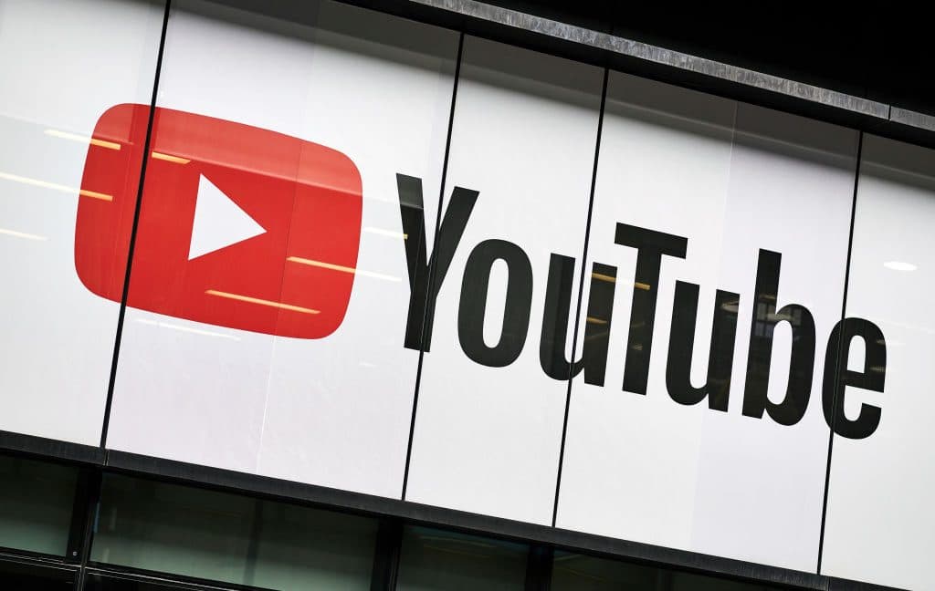 YouTube logo with AI-generated video label concept