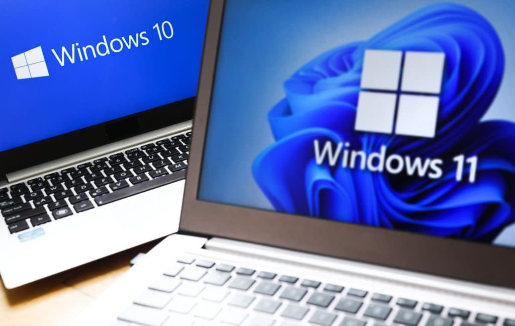 Microsoft logo with a backdrop of Windows 10 interface