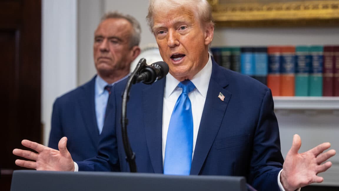 President Trump signing an executive order on childhood vaccine recommendations.