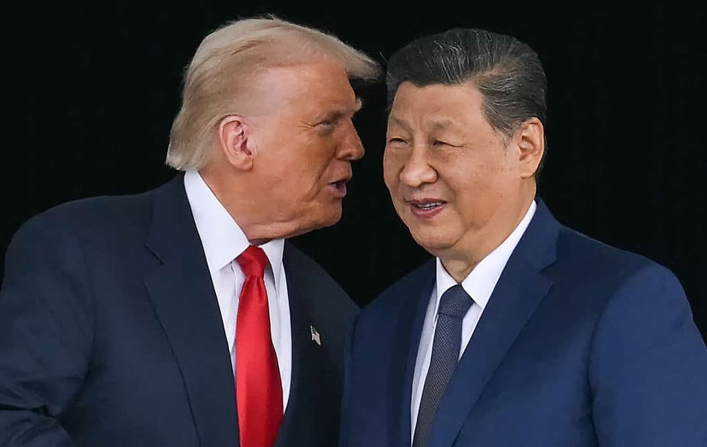 Jensen Huang at the summit discussing semiconductor trade with Trump and Xi.