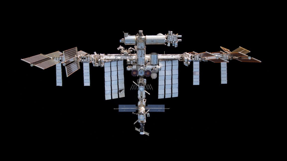 Astronauts aboard the ISS preparing for evacuation due to an air leak.
