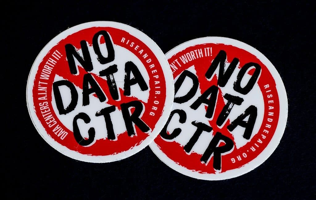 Protesters rally against AI data centers, highlighting community activism.