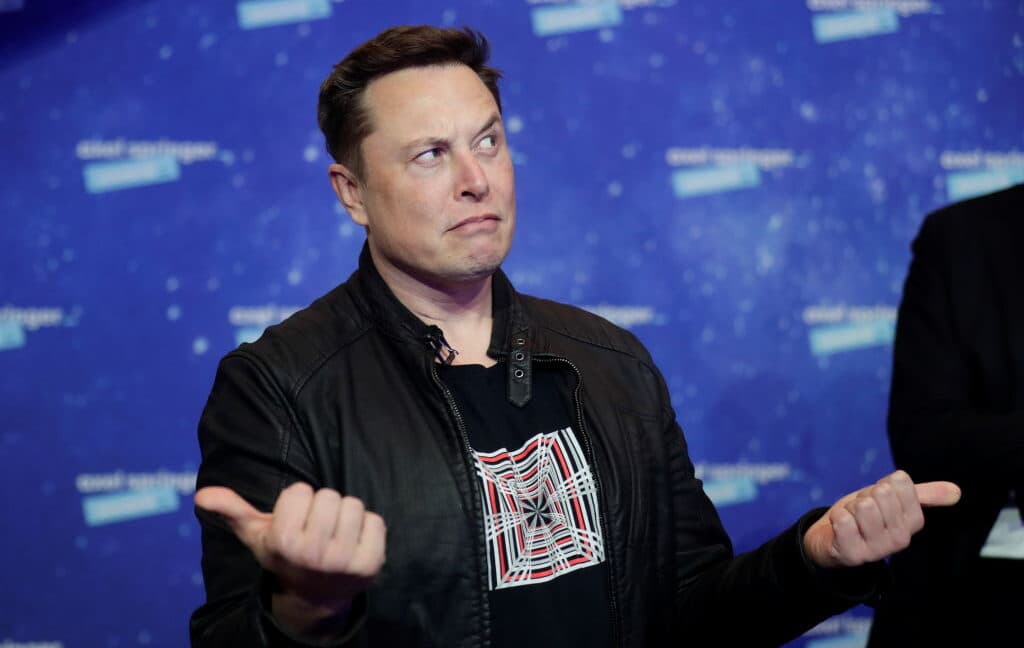 Elon Musk's X platform logo with advertising graphics