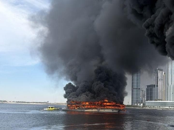Smoke rising from a boat fire in Dubai Creek, Dubai.