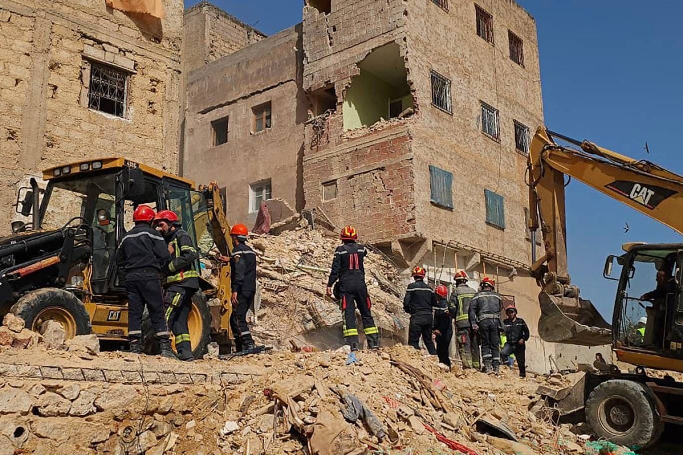 Emergency responders at the site of the building collapse in Fez, Morocco.