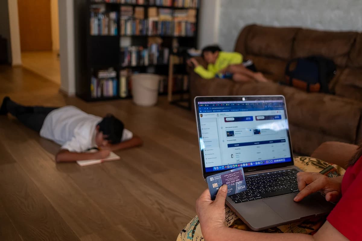 Students engaging in remote learning from home after school transition.