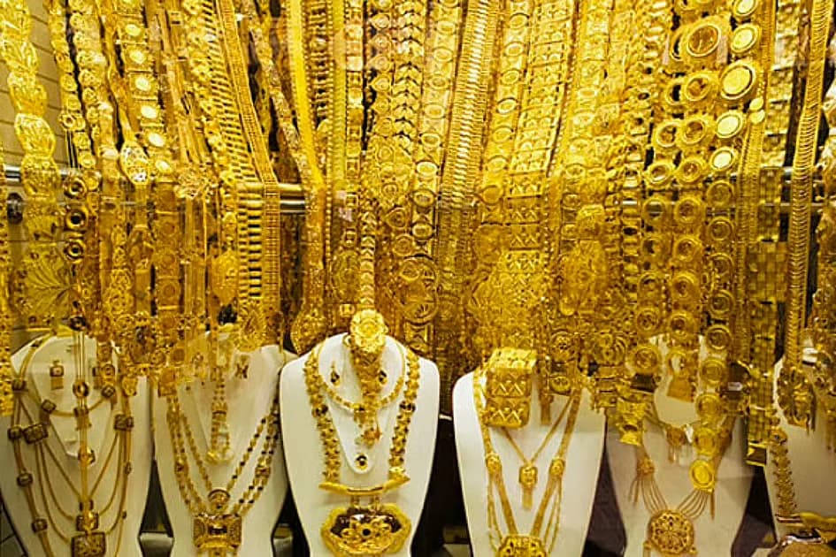Gold bars and coins representing investment opportunities in the UAE market.