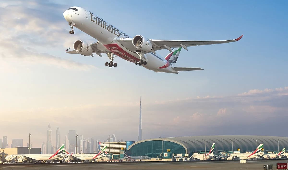 Infographic showing Emirates Group's record profit and operational metrics amidst regional military disruptions.