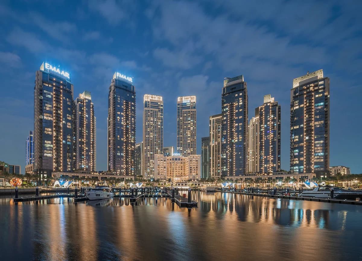 Dubai skyline with Emaar Properties logo and Dubai Holding branding
