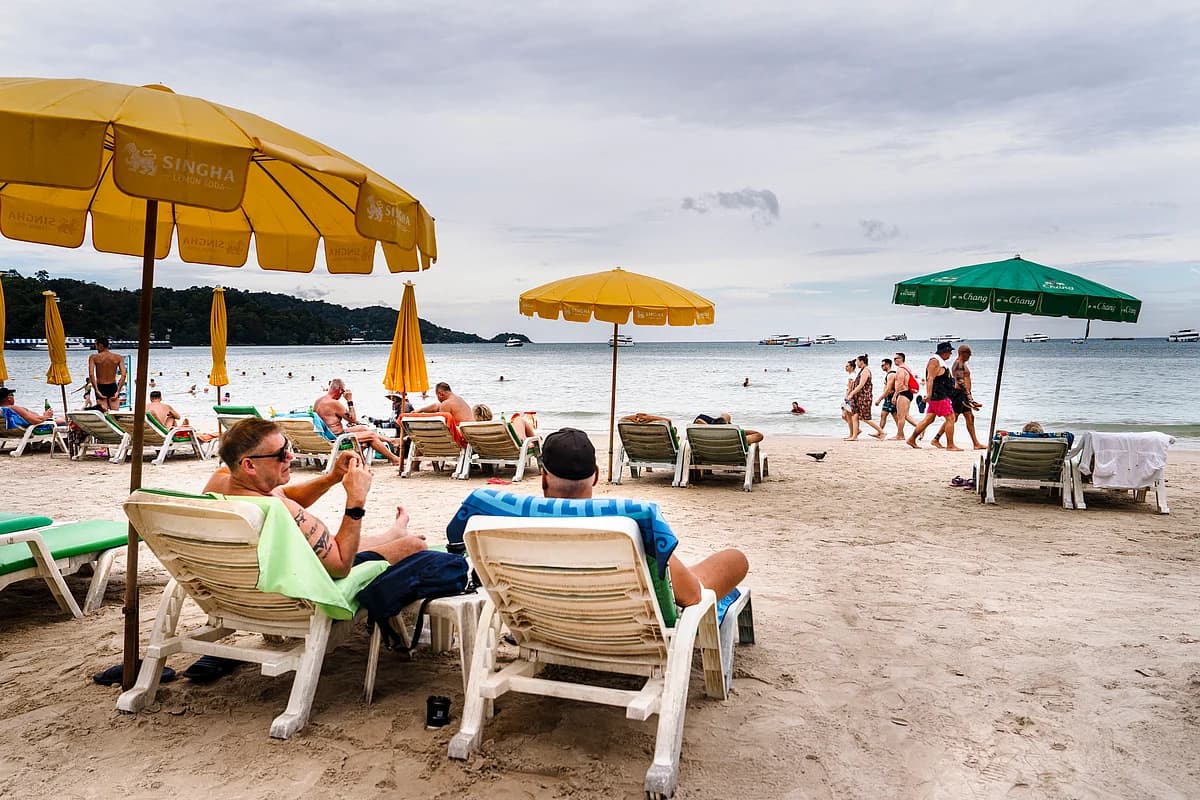 Tourists in Thailand with a backdrop of popular attractions.
