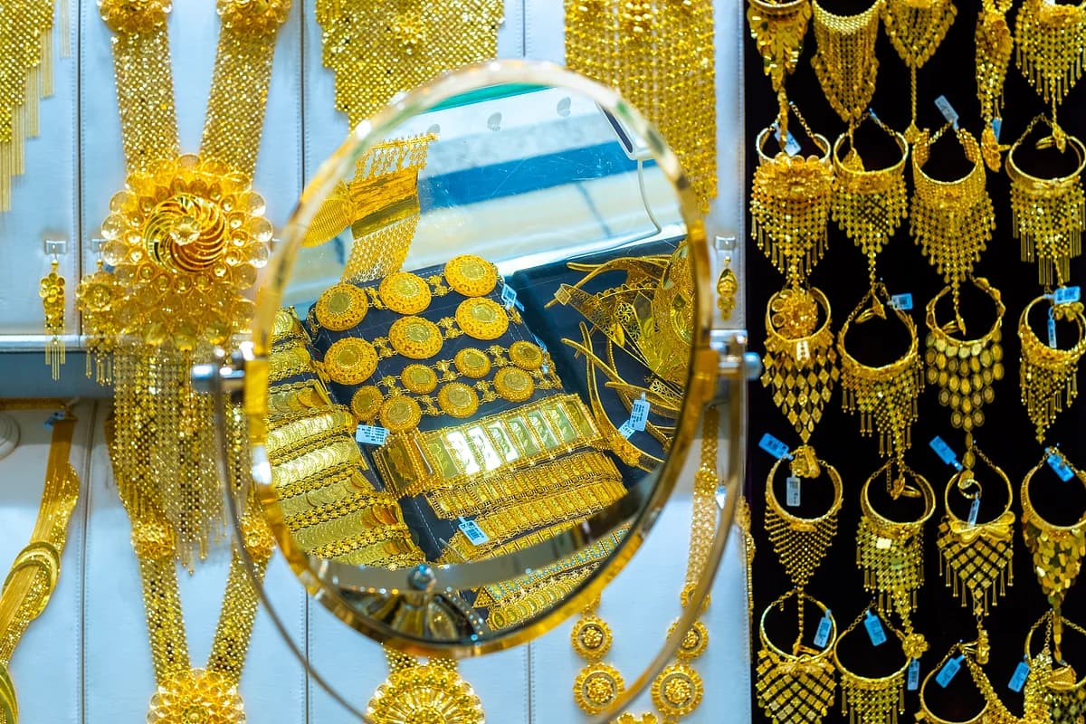 Gold bars with a backdrop of geopolitical tension graphics