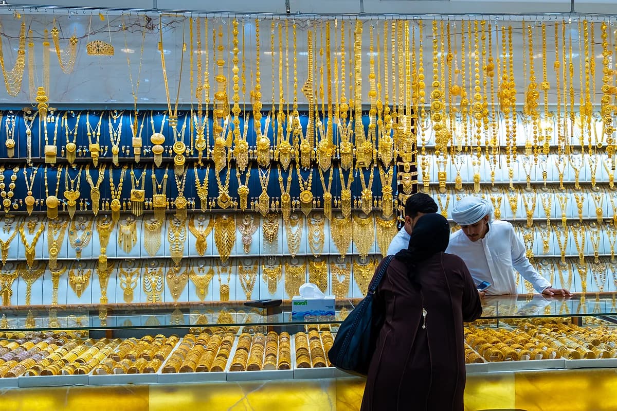 Gold jewelry displayed in a Dubai market during peak season.
