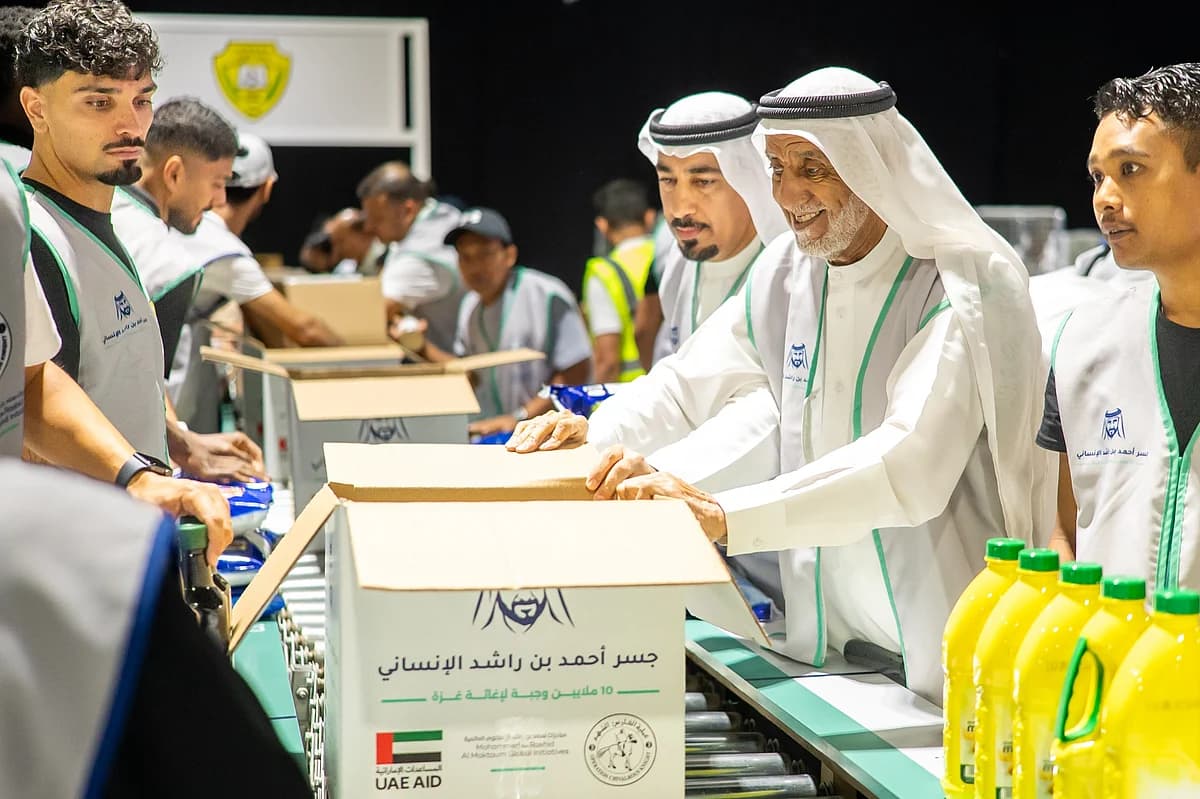 Volunteers at the UAE event packing meals for Gaza, honoring Sheikh Ahmed bin Rashid Al Maktoum's legacy.