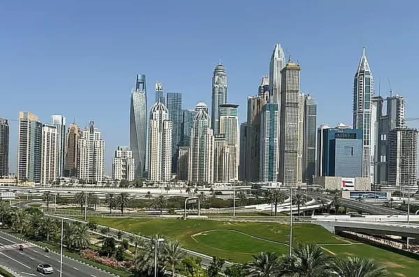 Infographic showing Dubai's designated areas for shared accommodation and new space standards.