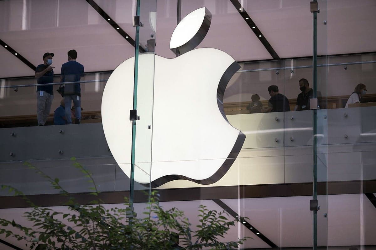 Apple logo with a backdrop of memory chips and price tags