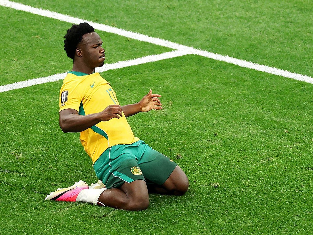 Australia celebrates their 2-0 victory over Turkey in the World Cup opener, showcasing key players and the scoreline.