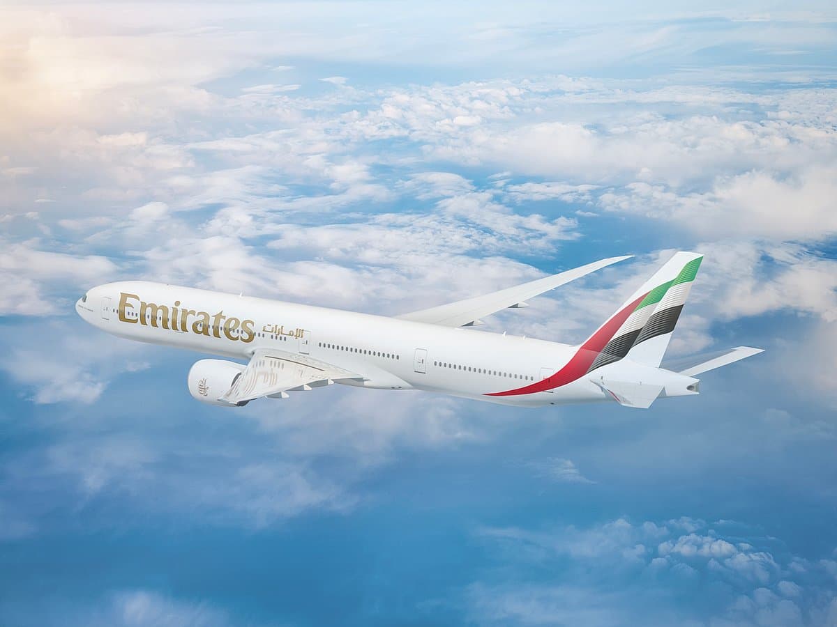 Emirates Airlines plane flying over Ghana's skyline