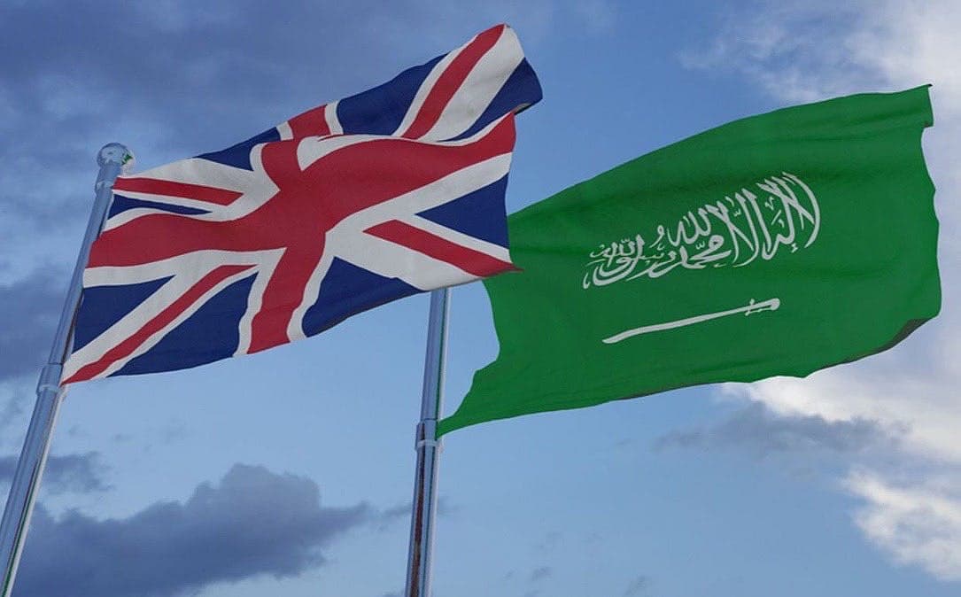 Saudi Arabia's skyline with a travel theme, representing new travel authorization for UK citizens.