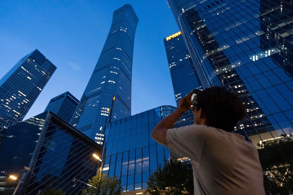 Light aircraft crashes into Beijing skyscraper during rush hour
