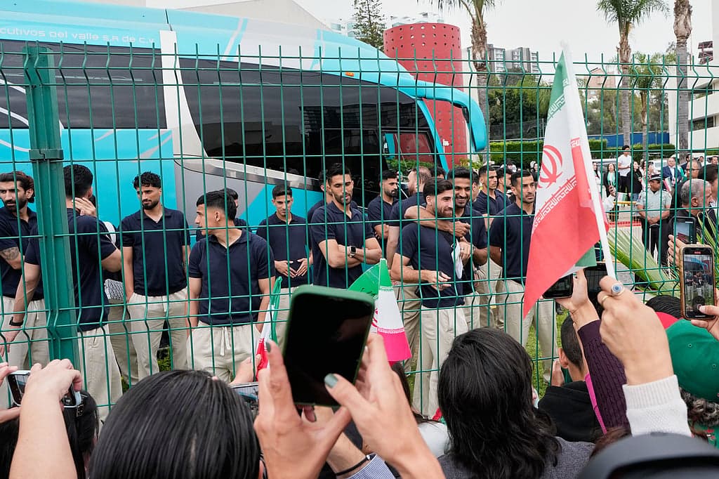 Iranian football team greeted by fans at Tehran airport after World Cup