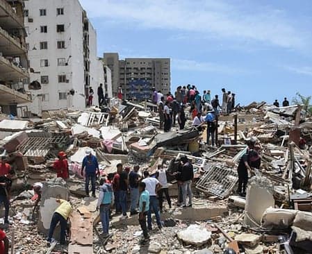 Aerial view of earthquake damage in Venezuela with emergency response teams.