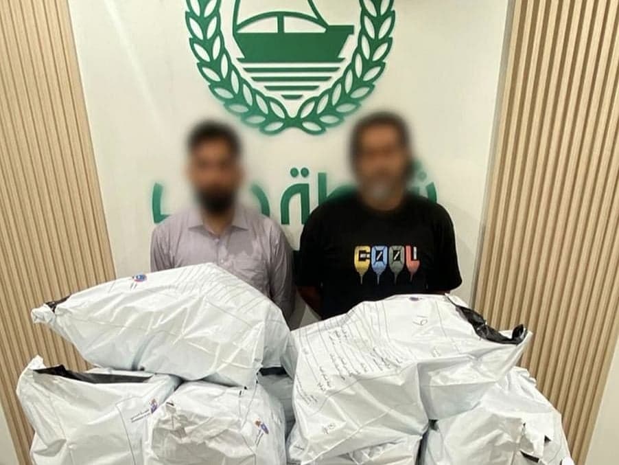 Dubai authorities showcasing seized narcotic pills and AI technology used in the operation.