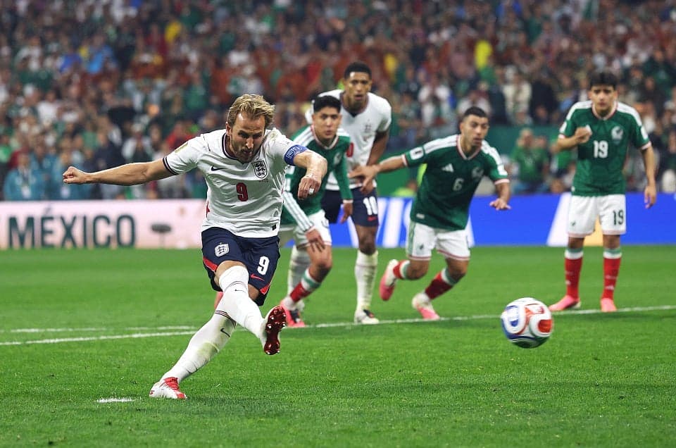 England football team celebrating their victory against Mexico in the World Cup quarter-finals.