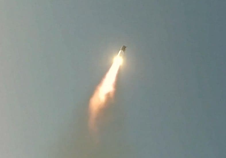 SpaceX Starship rocket launching with Starlink satellites