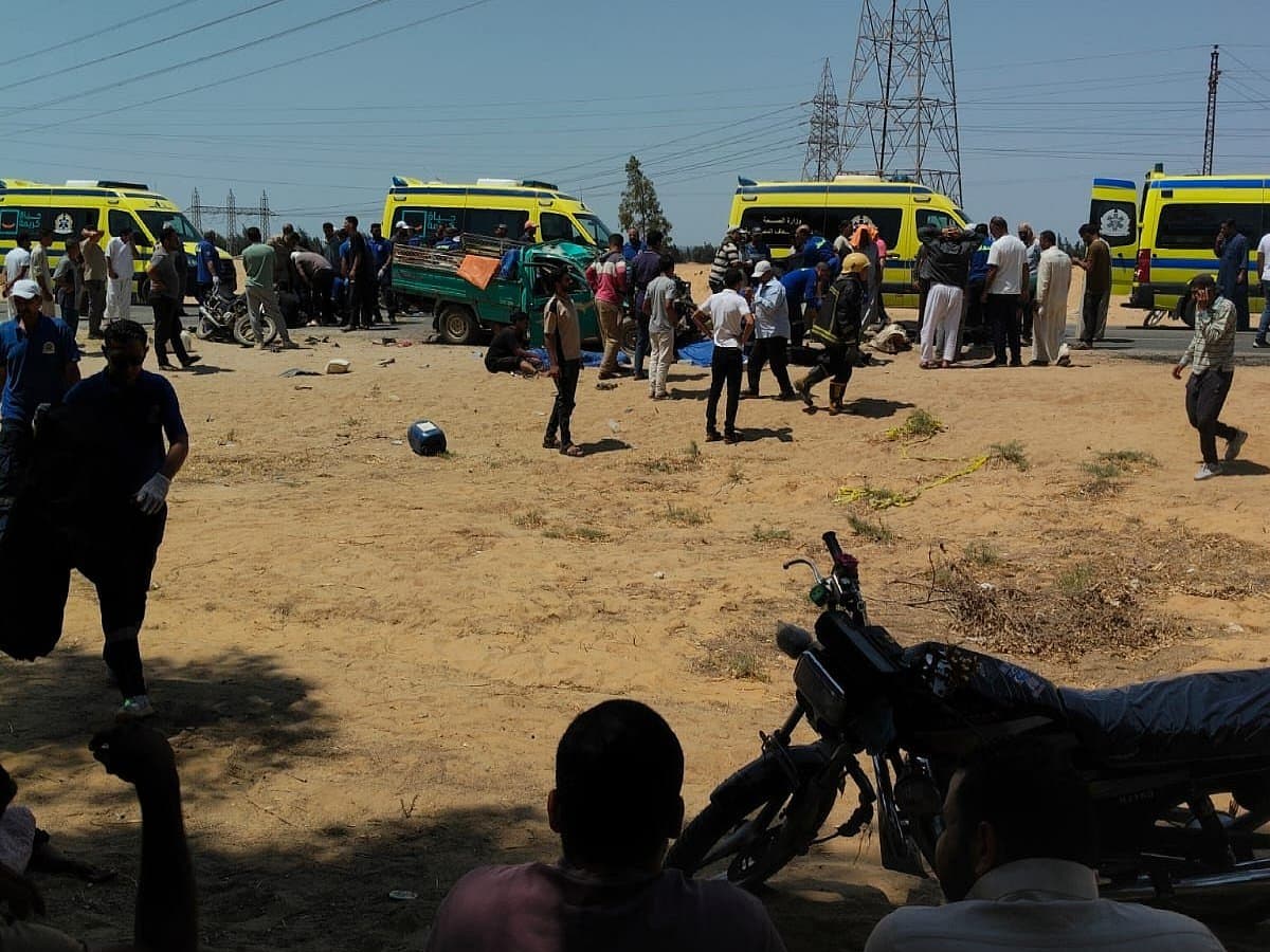 A somber scene depicting the aftermath of the truck collision in Ismailia, Egypt.