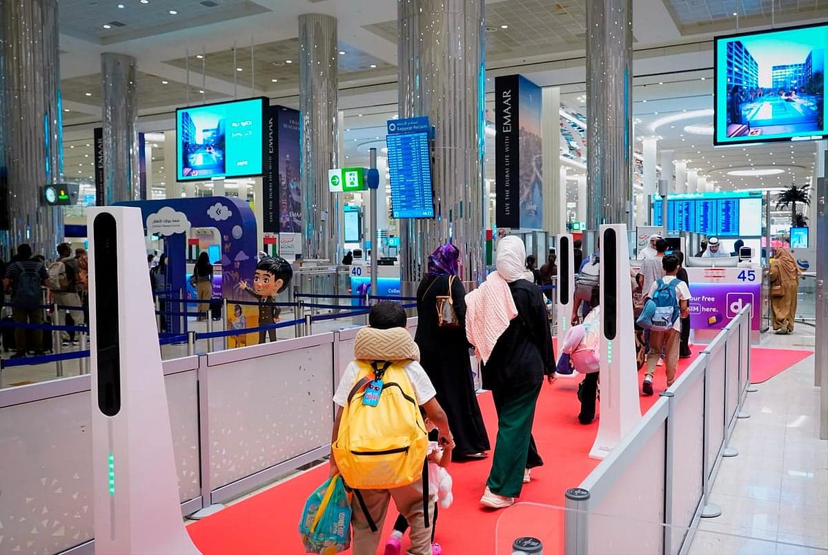 Passengers using smart gates at Dubai airport during holiday season