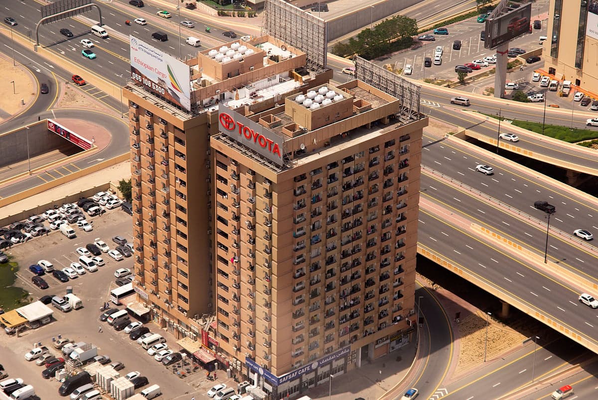 Infographic showing the timeline of the Toyota Building demolition and tenant evictions in Dubai.