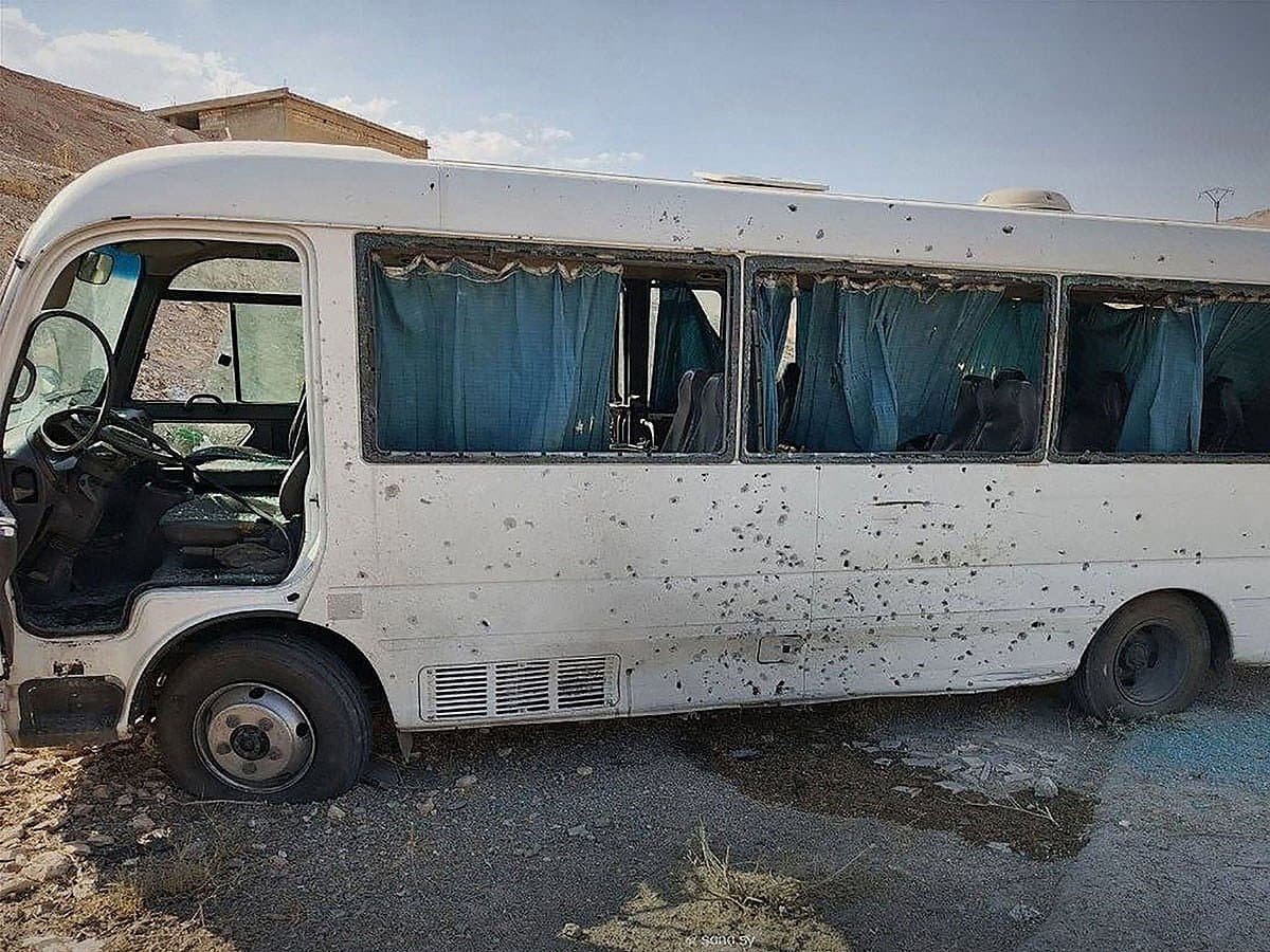 A damaged bus after an explosive device attack targeting Syrian security forces near Damascus.