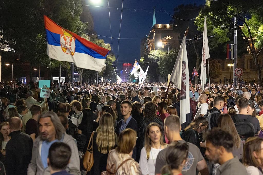 Large typography displaying Serbia election seat count over a dark minimalist backdrop