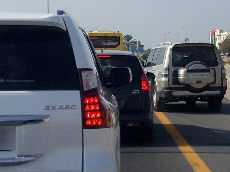 Dubai Police traffic enforcement on the hard shoulder