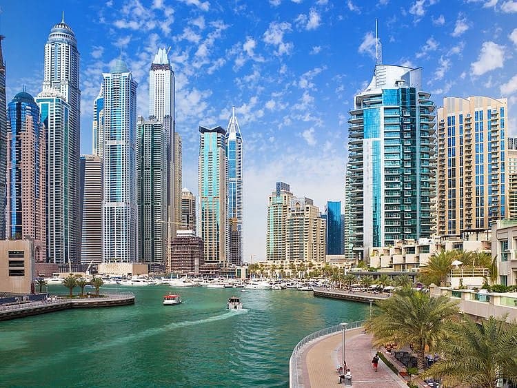 A vibrant image of Dubai's skyline with tourists enjoying the city.