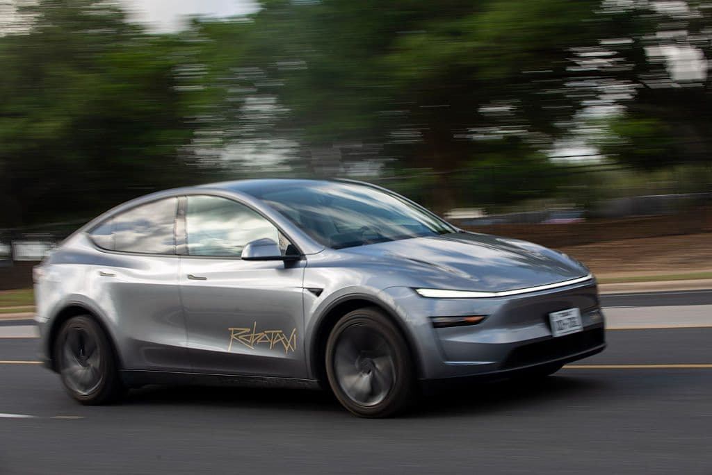 Tesla robotaxi on the road with safety measures highlighted