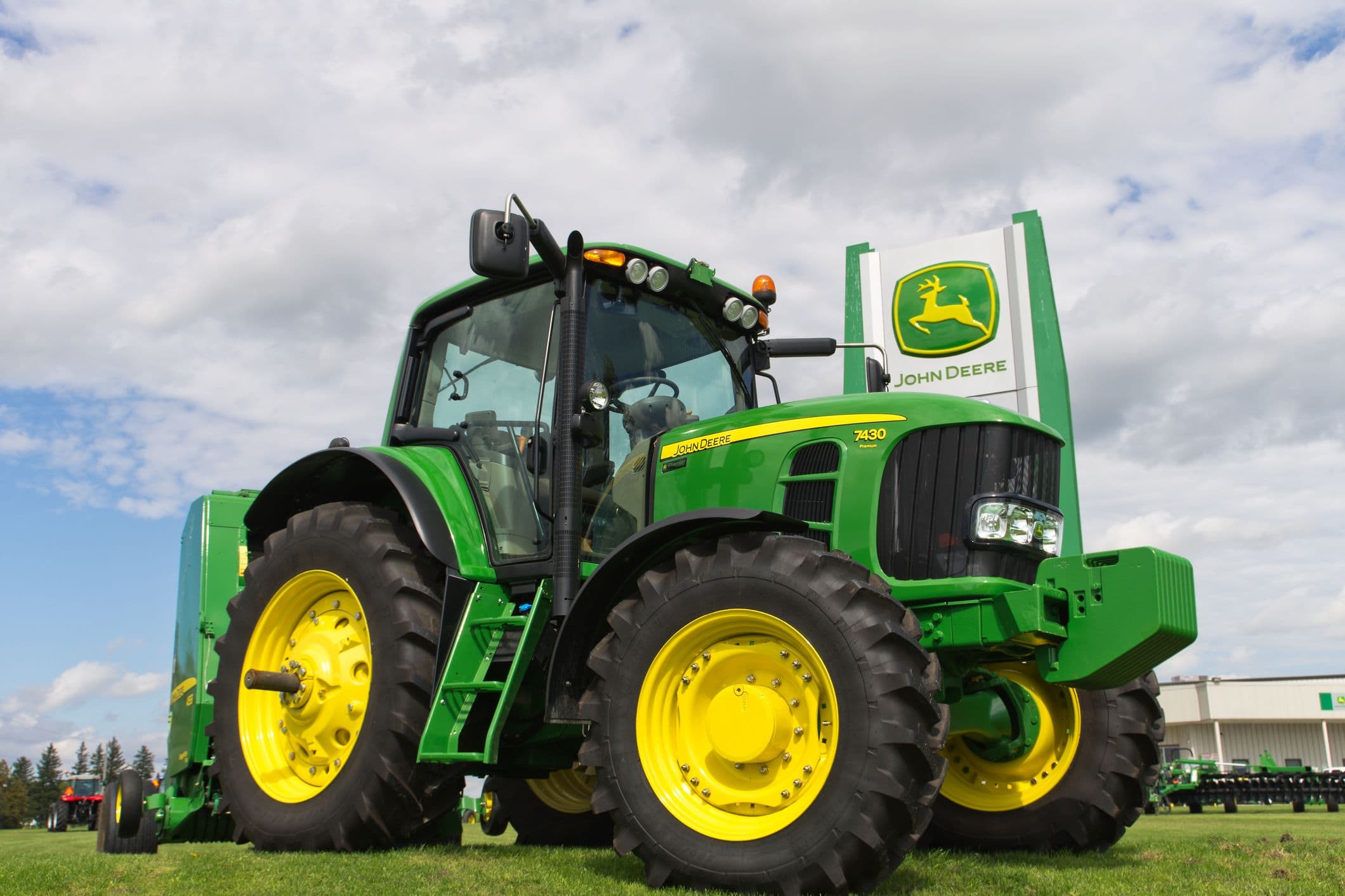 Farmers celebrating the right-to-repair settlement with John Deere.