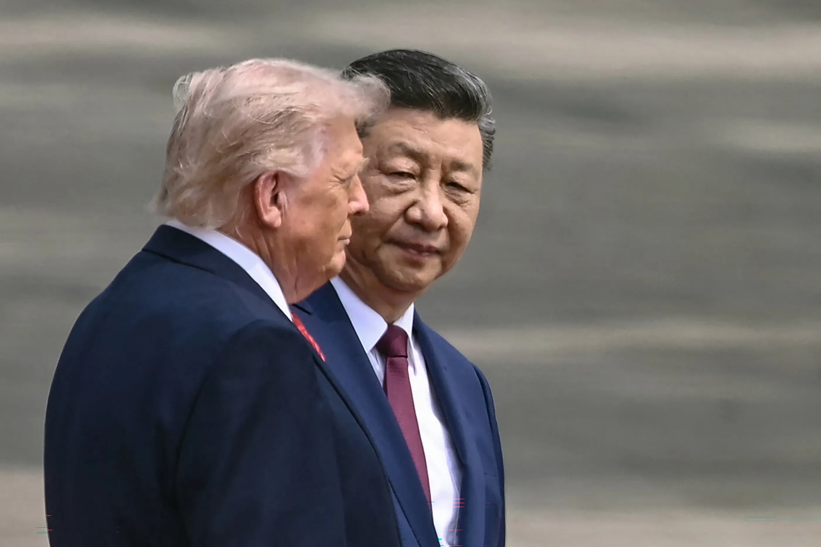 Infographic detailing the Trump-Xi summit agenda on AI, trade, and rare earth minerals.