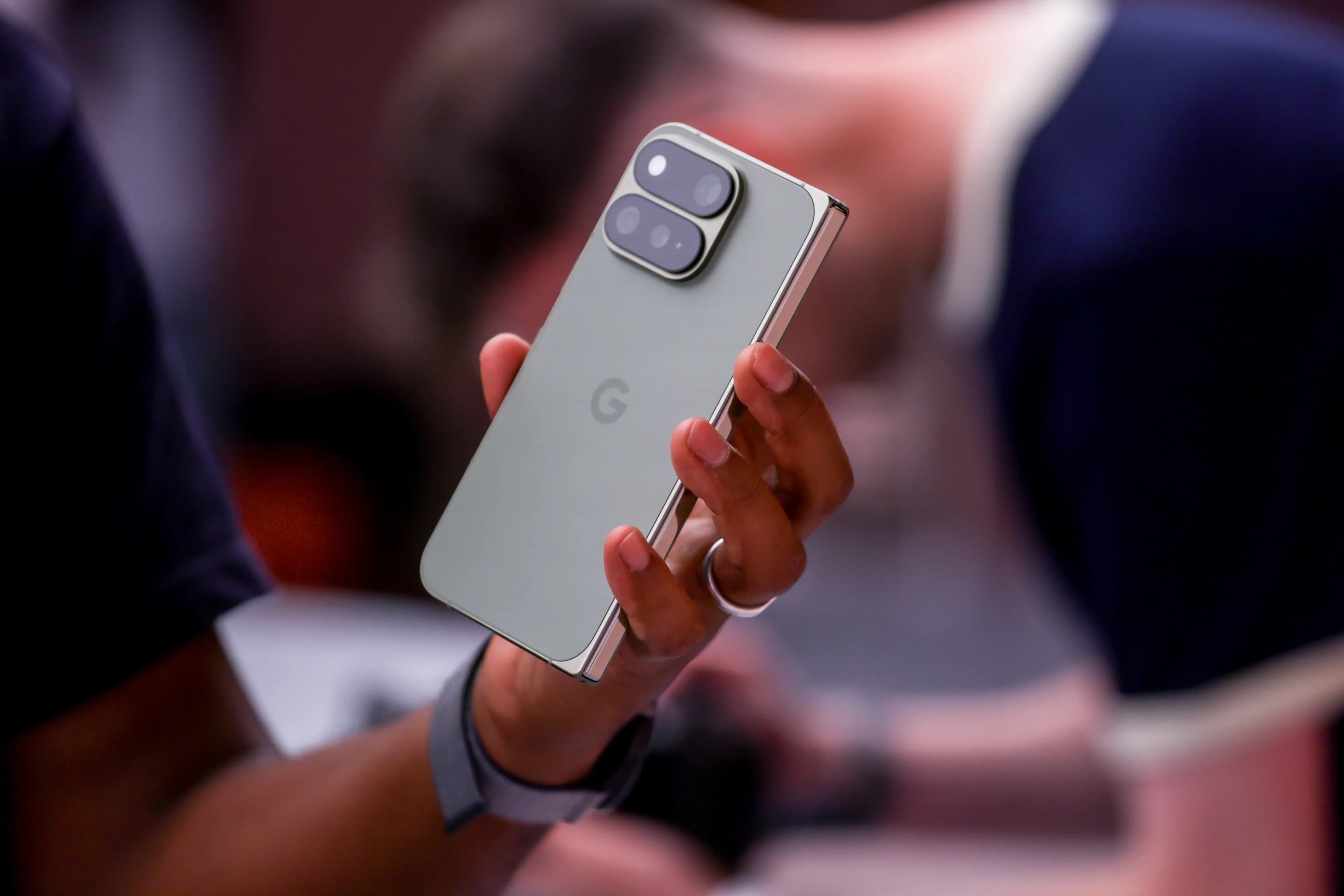 Pixel 11 smartphone displaying Google Gemini's 'Call for Me' feature in action.