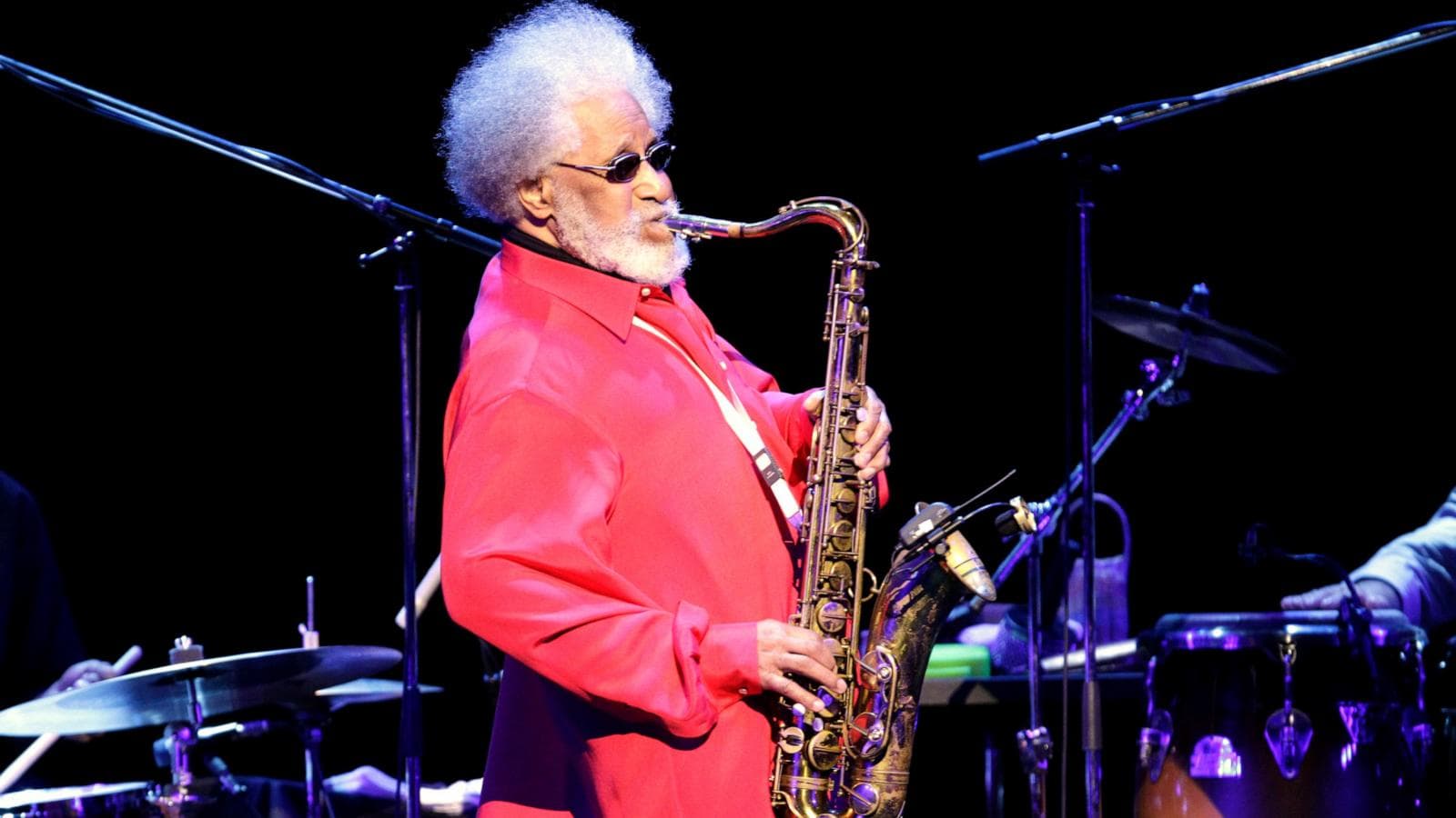 A silhouette of Sonny Rollins playing the saxophone, representing his influential legacy in jazz music.