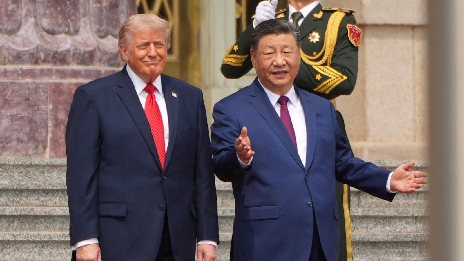 Trump and Xi Jinping shaking hands at Joint Base Andrews, symbolizing renewed U.S.-China diplomatic relations.