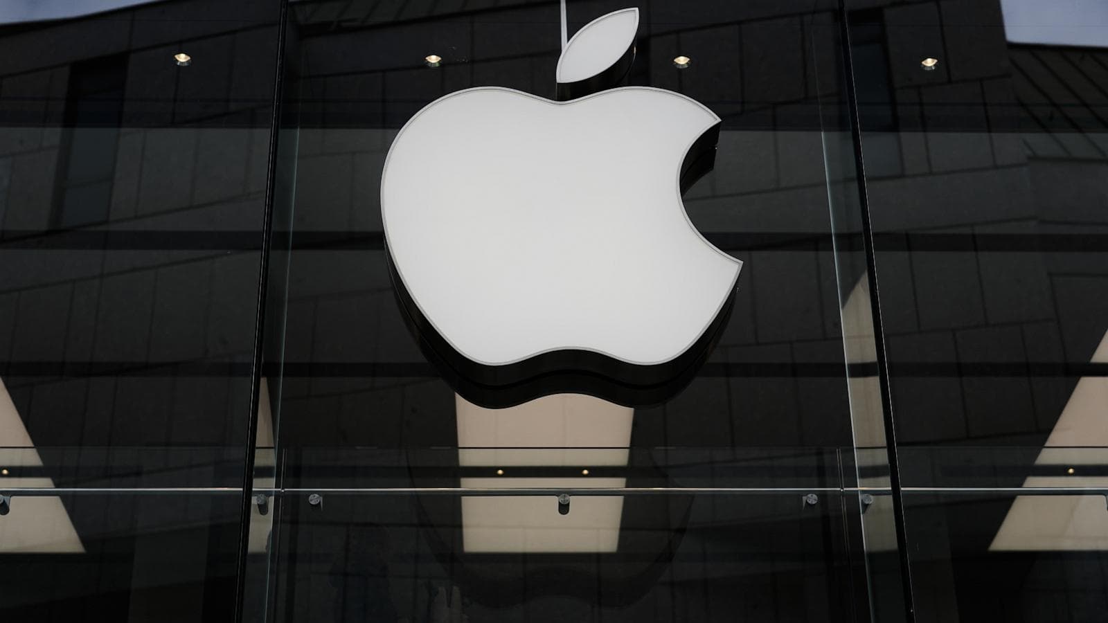 Apple logo with financial growth chart background