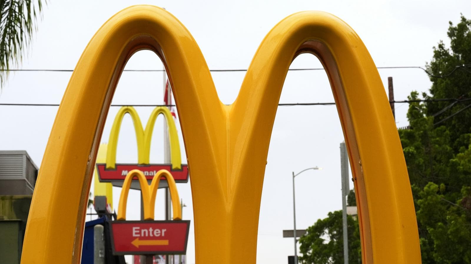 Infographic showing McDonald's menu price increases and details of the AI pricing lawsuit.