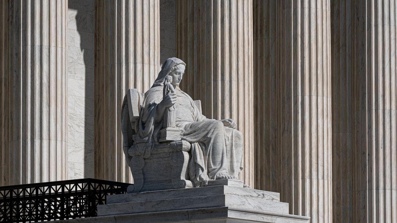 Supreme Court building with a gavel symbolizing regulatory authority over telecom companies.