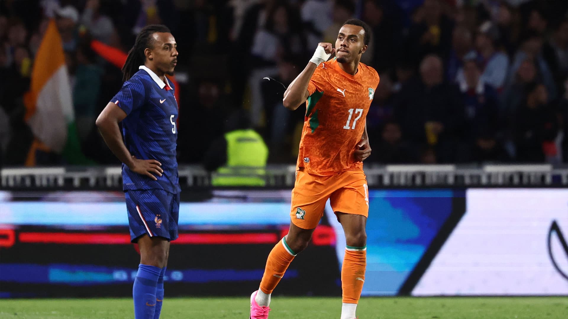 Ivory Coast players celebrating their victory over France in a friendly match.