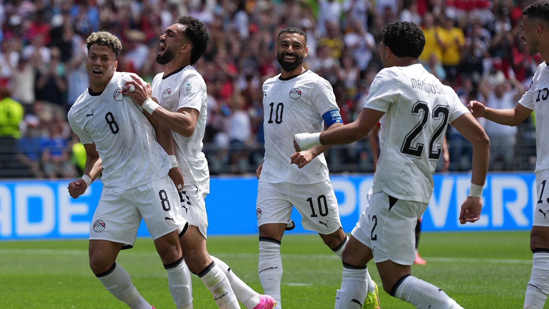 Fans celebrating during the 2026 World Cup group stage matches.