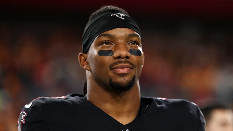 Bijan Robinson celebrating after signing his record contract extension with the Atlanta Falcons.